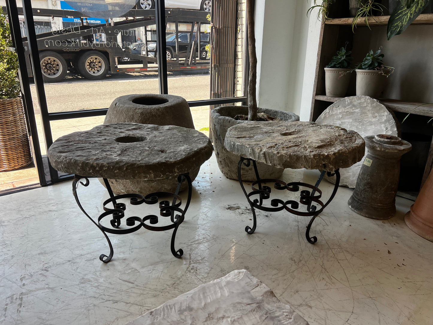 Side tables, limestone top and iron base 